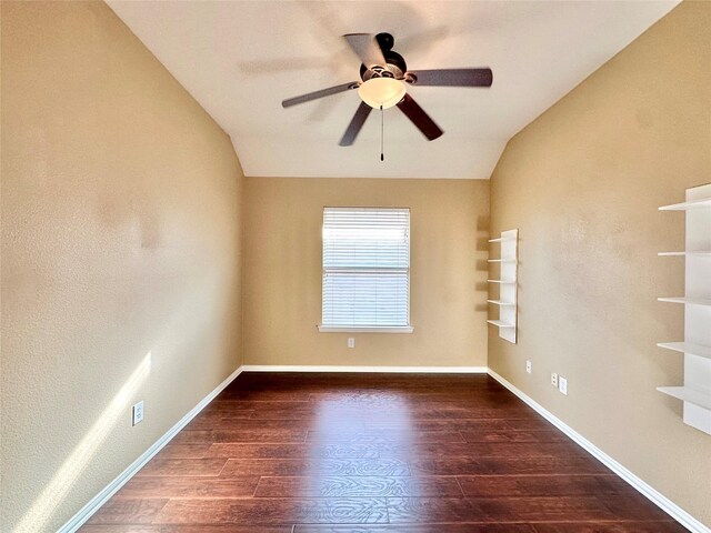 unfurnished room featuring dark hardwood / wood-style flooring, ceiling fan, and lofted ceiling