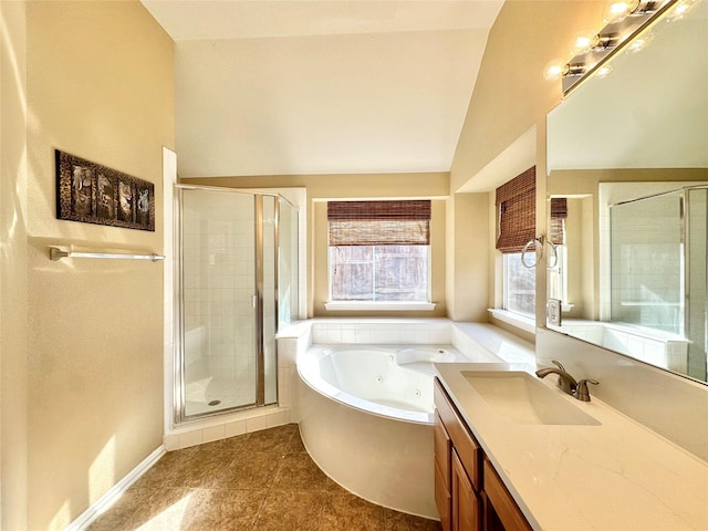 bathroom with tile patterned floors, vanity, lofted ceiling, and shower with separate bathtub