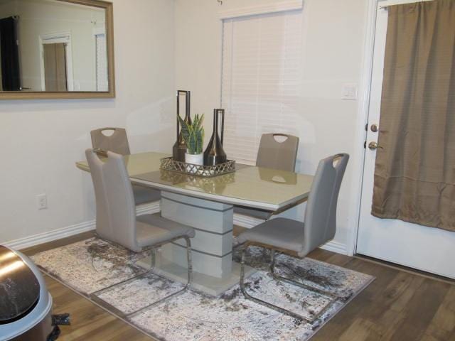 dining room with dark hardwood / wood-style floors