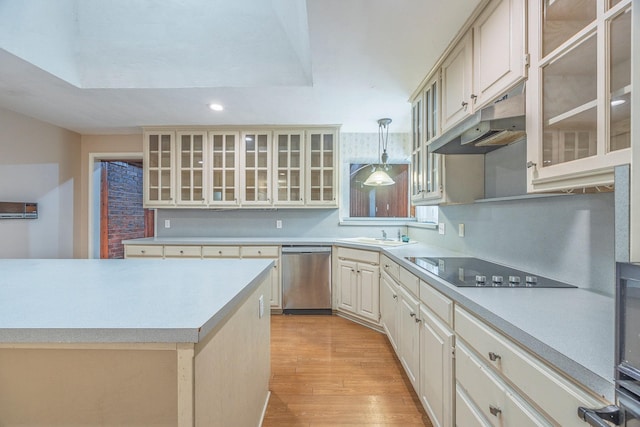 kitchen featuring dishwasher, decorative light fixtures, cream cabinetry, black electric stovetop, and light wood-type flooring