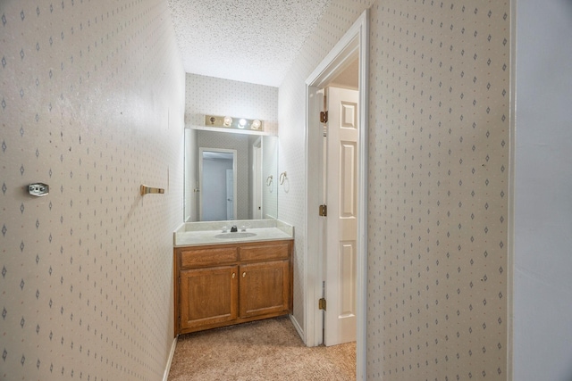 bathroom with vanity and a textured ceiling