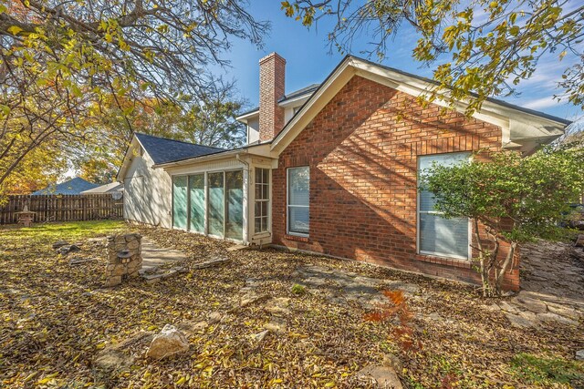 back of property featuring a sunroom