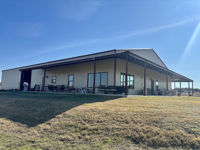 view of side of property with a yard