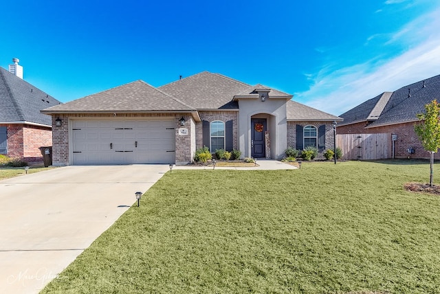 view of front facade with a garage and a front yard