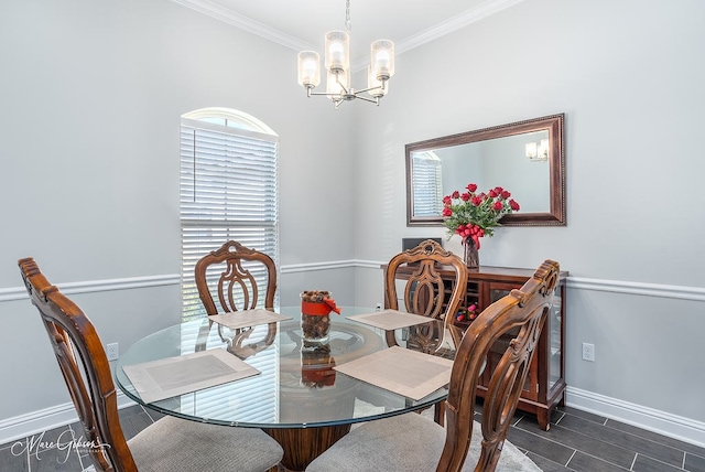 dining room featuring crown molding and an inviting chandelier