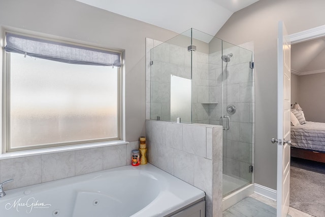 bathroom featuring lofted ceiling and shower with separate bathtub