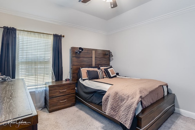 carpeted bedroom featuring ceiling fan and ornamental molding