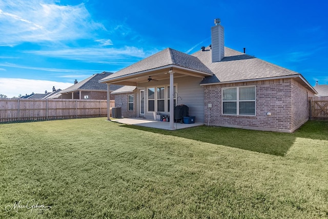 back of property featuring a patio, a yard, central AC, and ceiling fan