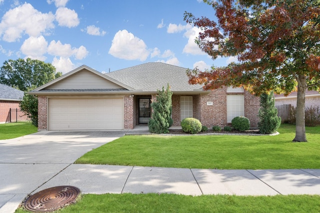 single story home featuring a front yard and a garage