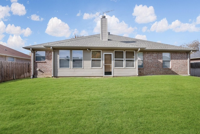 back of house with a yard