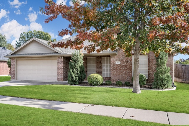 ranch-style house featuring a garage and a front lawn