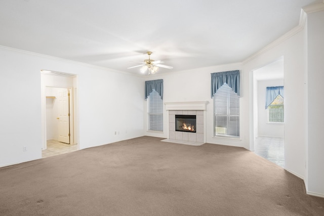 unfurnished living room with ceiling fan, light colored carpet, and ornamental molding