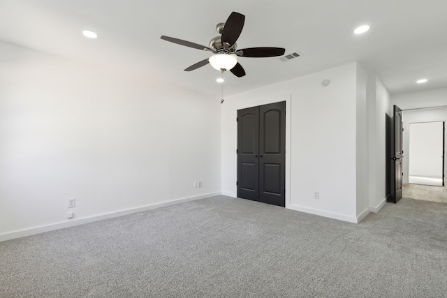 unfurnished bedroom featuring visible vents, baseboards, a ceiling fan, light colored carpet, and recessed lighting