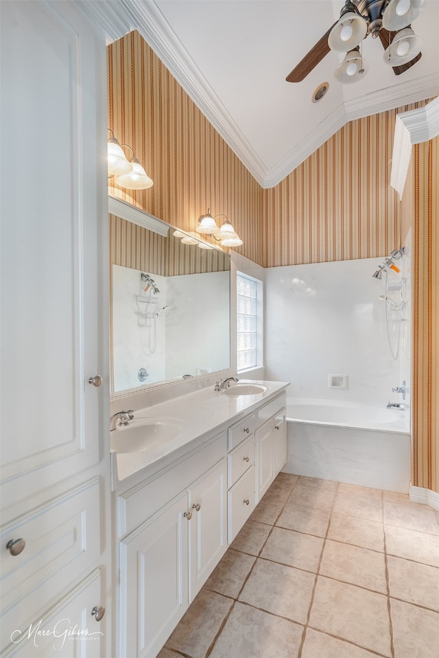 bathroom with tile patterned floors, lofted ceiling, crown molding, vanity, and ceiling fan