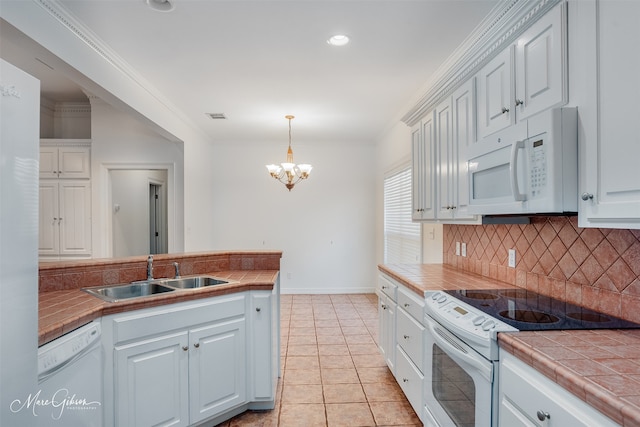 kitchen featuring white cabinetry, white appliances, tile countertops, and sink