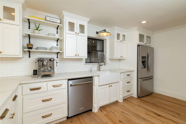 kitchen with sink, white cabinetry, and appliances with stainless steel finishes