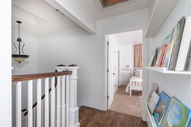 corridor with dark hardwood / wood-style floors