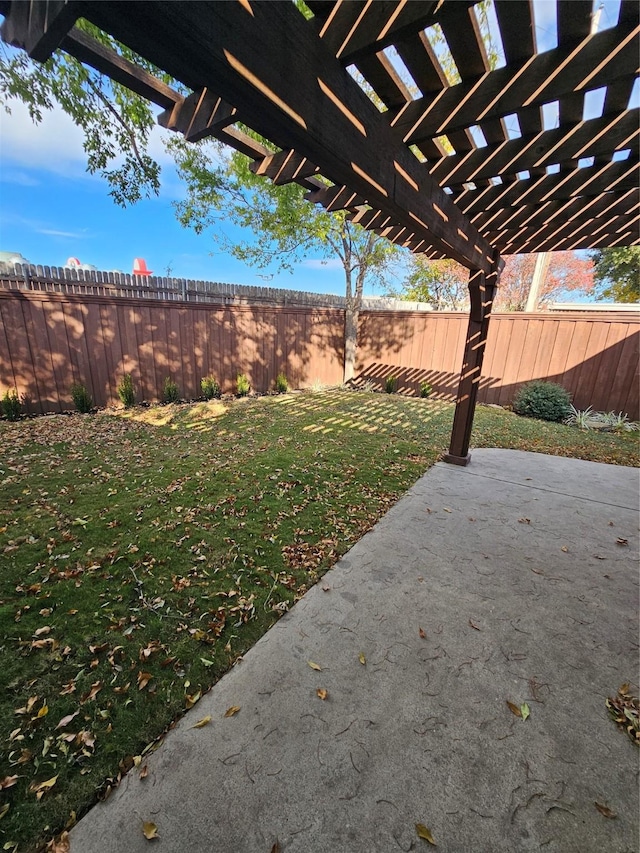 view of yard with a pergola and a patio area