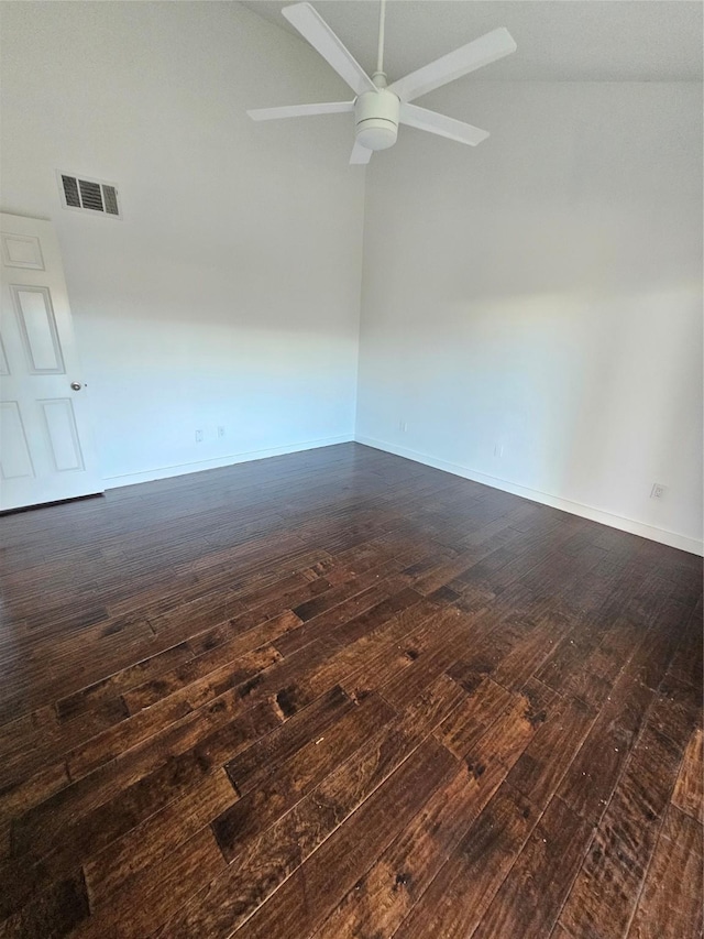 unfurnished room with dark hardwood / wood-style flooring, lofted ceiling, and ceiling fan