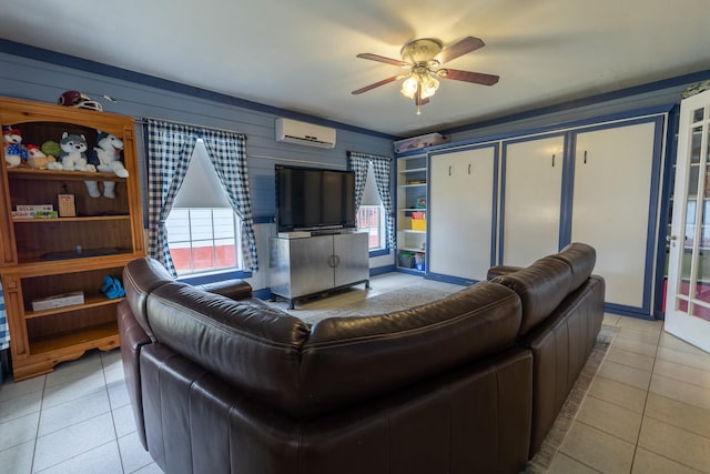 tiled living room featuring a wall mounted air conditioner and ceiling fan