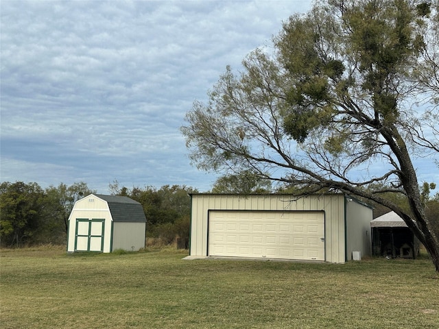 garage featuring a yard