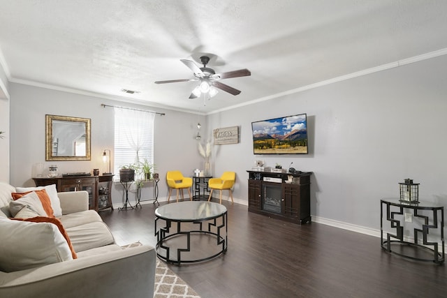 living room featuring a textured ceiling, dark hardwood / wood-style floors, ceiling fan, and crown molding