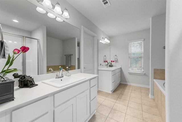 bathroom with vanity, tile patterned floors, and independent shower and bath