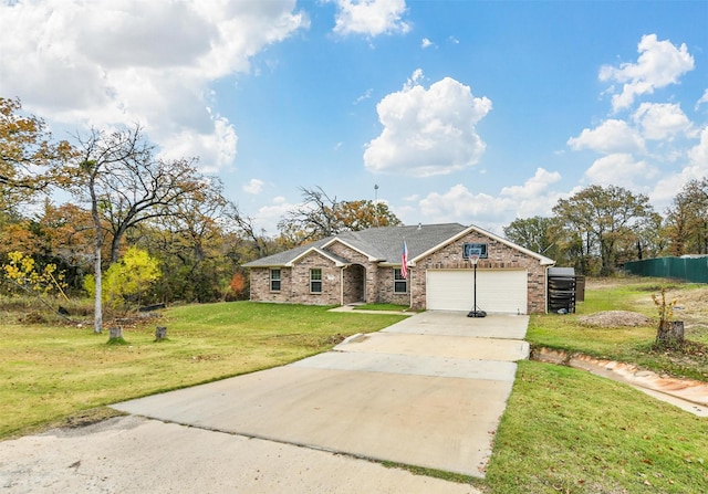 view of front of property featuring a front yard and a garage