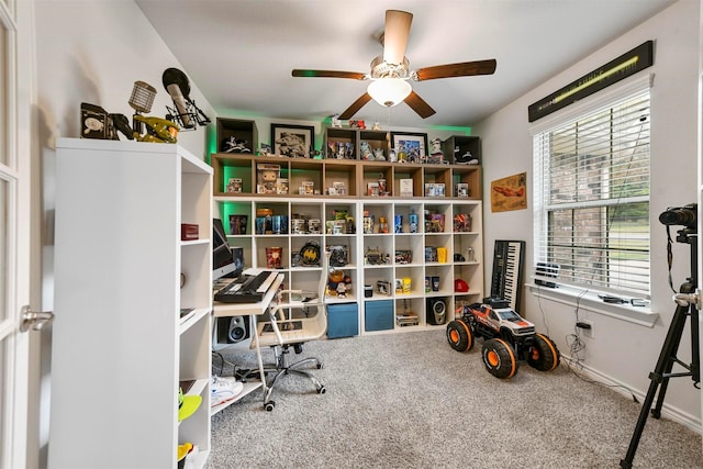 office space featuring ceiling fan and carpet floors