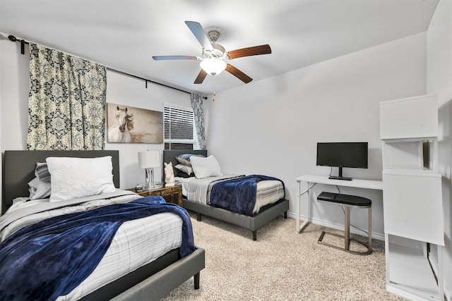 bedroom with ceiling fan and light colored carpet