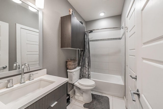 full bath with toilet, tile patterned flooring, shower / bath combo with shower curtain, and vanity