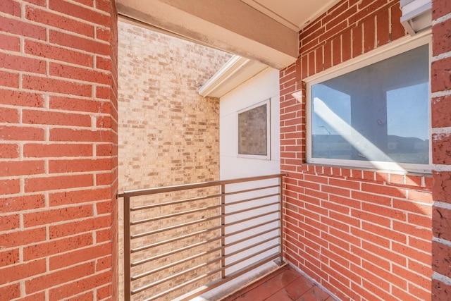 property entrance with brick siding