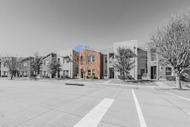 view of road with curbs, sidewalks, and a residential view