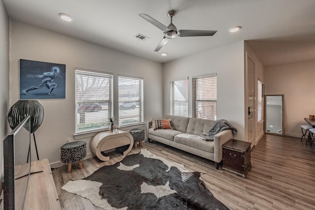 living room with baseboards, visible vents, ceiling fan, wood finished floors, and recessed lighting