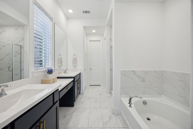 bathroom with vanity and independent shower and bath