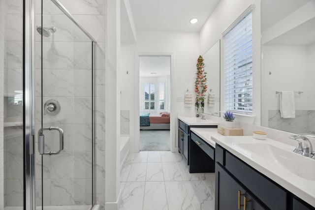 bathroom with an enclosed shower and vanity