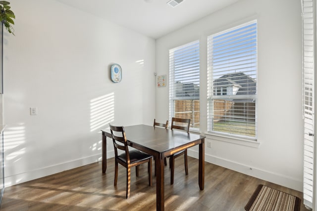 dining room featuring dark hardwood / wood-style flooring