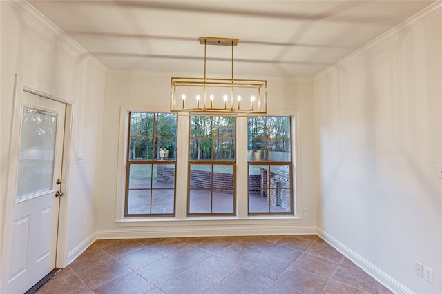 unfurnished dining area with an inviting chandelier, crown molding, and dark tile patterned floors