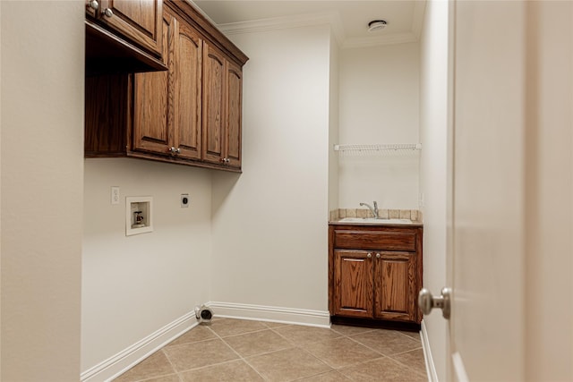 laundry room featuring sink, crown molding, cabinets, light tile patterned floors, and electric dryer hookup