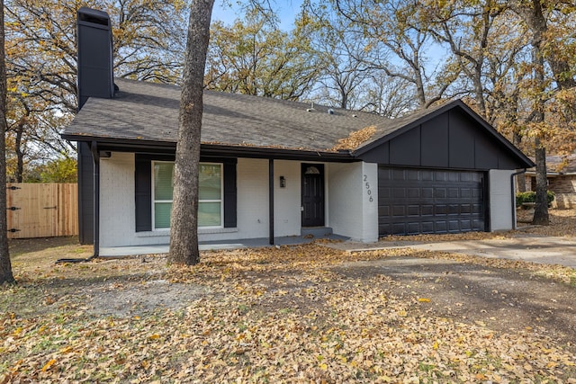 single story home with a porch and a garage