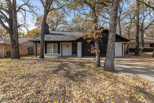 ranch-style house featuring a garage