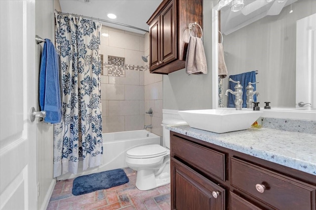 full bathroom with shower / bathtub combination with curtain, vanity, and toilet