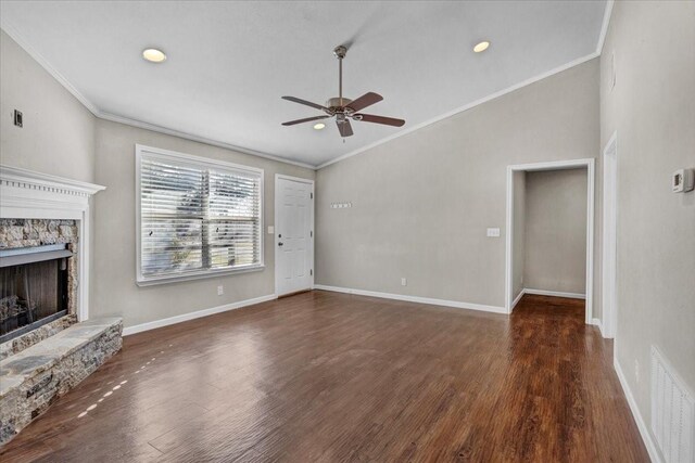 unfurnished living room with a fireplace, crown molding, and dark wood-type flooring