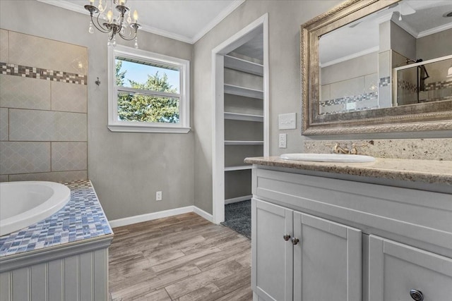 3529 Bennett Ln, Sherman, TX 75092 - bathroom featuring baseboards, crown molding, a shower stall, vanity, and wood finished floors