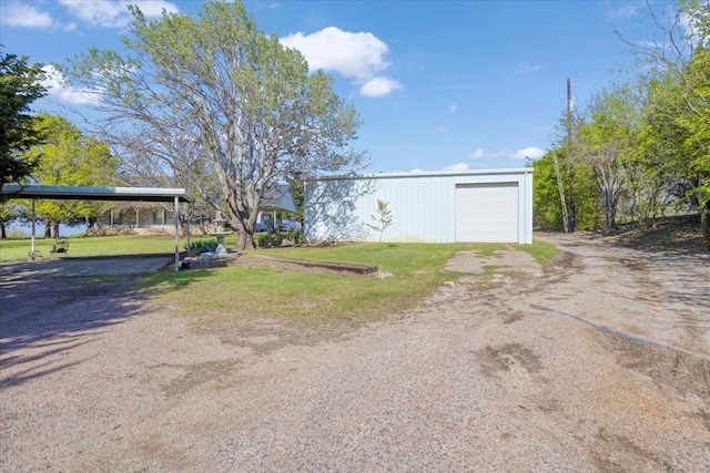 3529 Bennett Ln, Sherman, TX 75092 - view of front of property featuring a front lawn, a detached garage, an outdoor structure, and dirt driveway