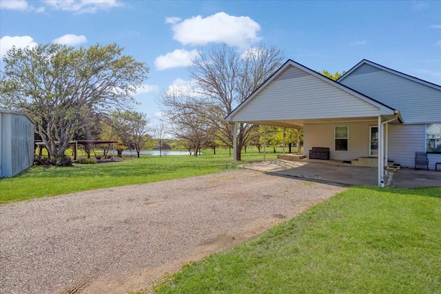 3529 Bennett Ln, Sherman, TX 75092 - exterior space with driveway and a water view