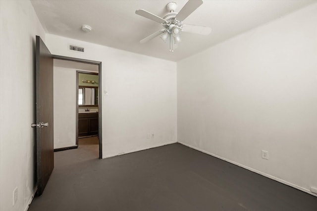 empty room featuring ceiling fan and sink