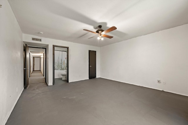 unfurnished bedroom featuring connected bathroom and ceiling fan