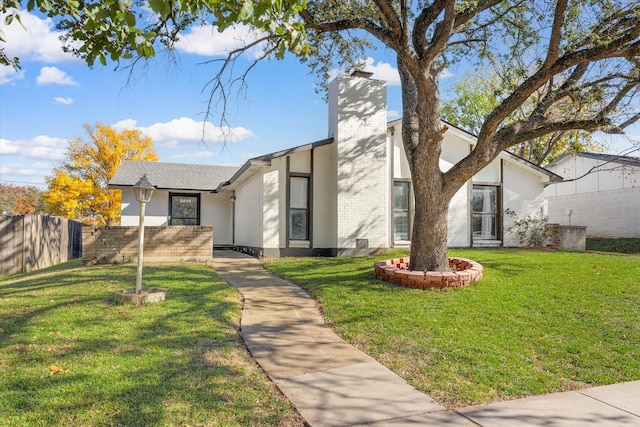 view of front of property with a front lawn