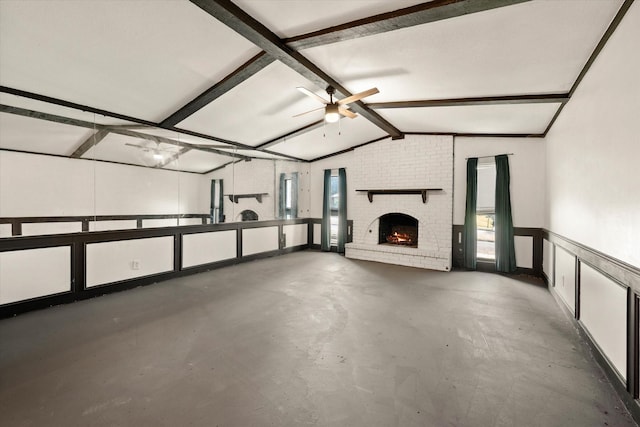 garage featuring a brick fireplace and ceiling fan